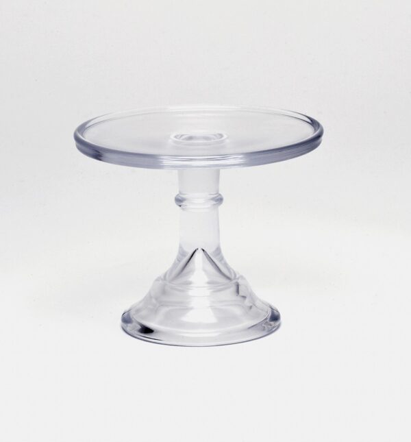 Clear acrylic cake stand with pedestal base on white background.