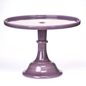 Purple ceramic cake stand with a pedestal base and round top.
