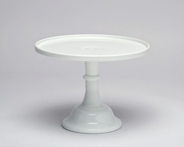 White ceramic cake stand with a simple, elegant design.