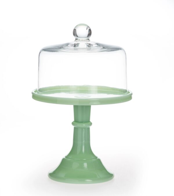 Green cake stand with a glass dome cover.