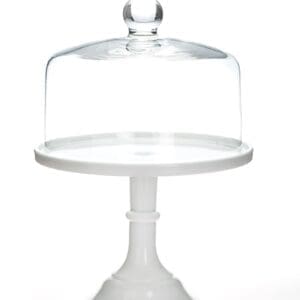 Elegant white cake stand with a clear glass dome cover.