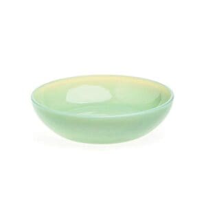 A small, light green ceramic bowl with a smooth finish.