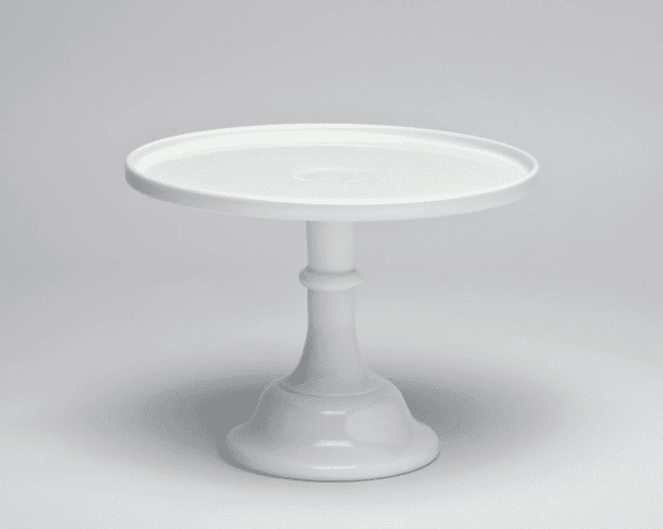White ceramic cake stand with a pedestal base.