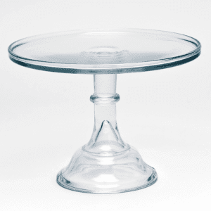 A clear glass cake stand with a pedestal base.