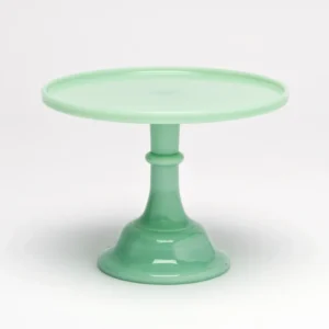 Elegant green glass cake stand with a pedestal base.