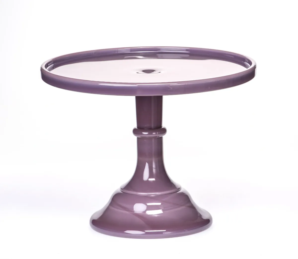 Purple ceramic cake stand with a round top and sturdy base.